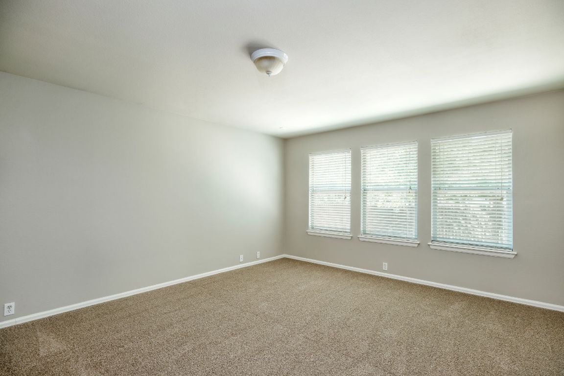 409 Lark Street Leander, TX 78641 - Photo 5 of 14 an empty room with a window