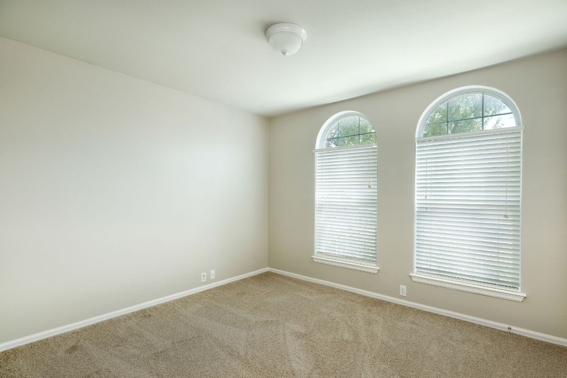 409 Lark Street Leander, TX 78641 - Photo 9 of 14 an empty room with windows