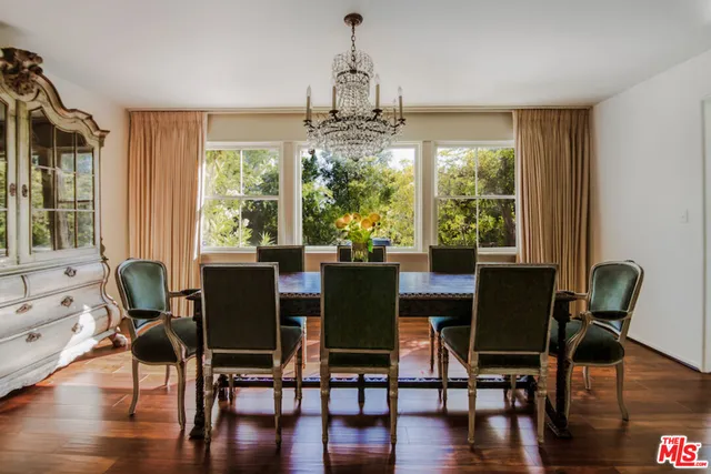 a dining room with furniture window wooden floor