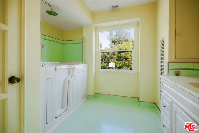 a view of a room that has a large window