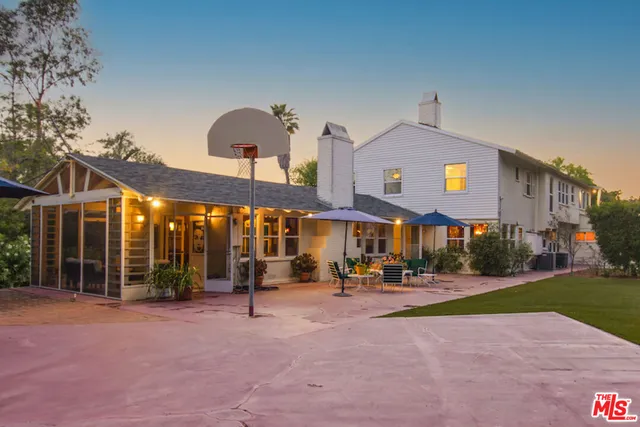 a group of people sitting in front of building