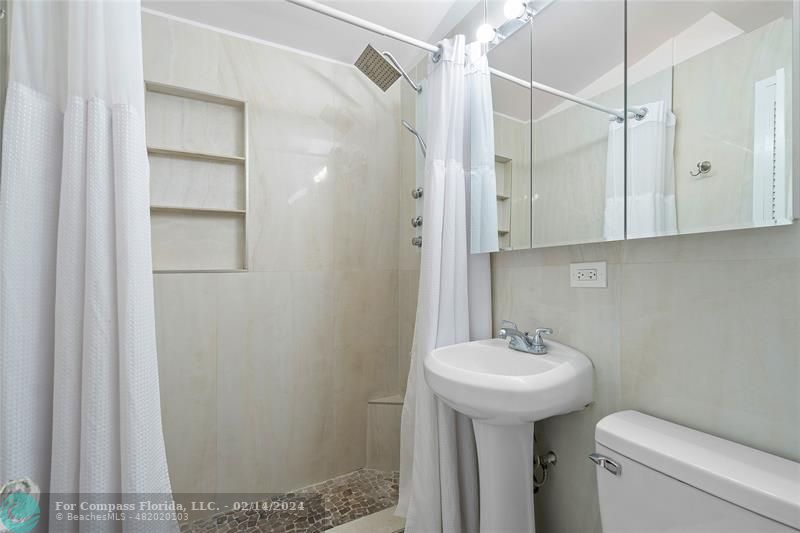 321 Forsyth Street Boca Raton, FL 33487 - Photo 14 of 22 a bathroom with a sink toilet and shower