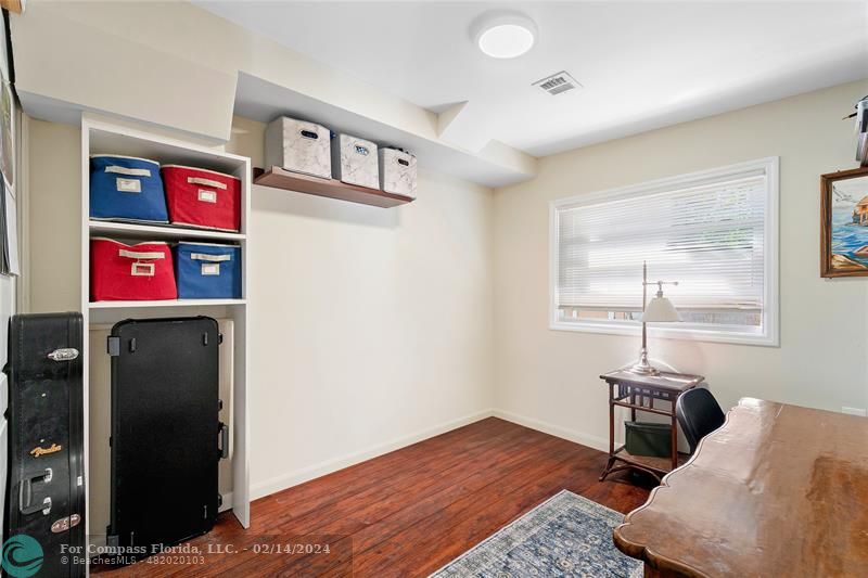 321 Forsyth Street Boca Raton, FL 33487 - Photo 16 of 22 a bedroom with a bed and a window