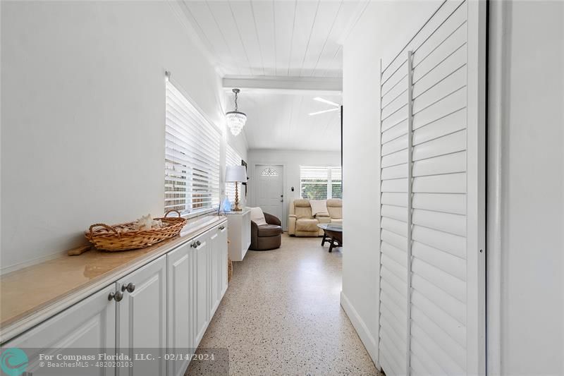 321 Forsyth Street Boca Raton, FL 33487 - Photo 4 of 22 a kitchen with a sink and white cabinets