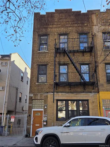 a front view of a building with parking space