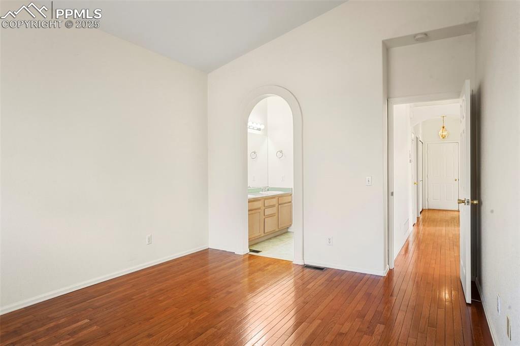 1244 Samuel Point Colorado Springs, CO 80906 - Photo 13 of 22 a view of empty room with wooden floor