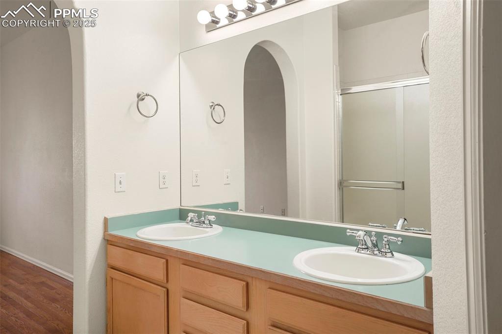 1244 Samuel Point Colorado Springs, CO 80906 - Photo 15 of 22 a bathroom with a sink and a mirror