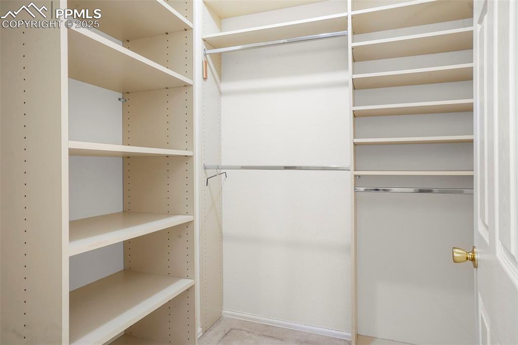 1244 Samuel Point Colorado Springs, CO 80906 - Photo 16 of 22 a view of walk in closet with empty racks