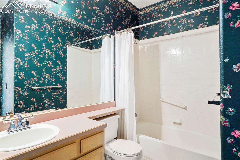 1244 Samuel Point Colorado Springs, CO 80906 - Photo 17 of 22 a bathroom with a sink toilet and shower