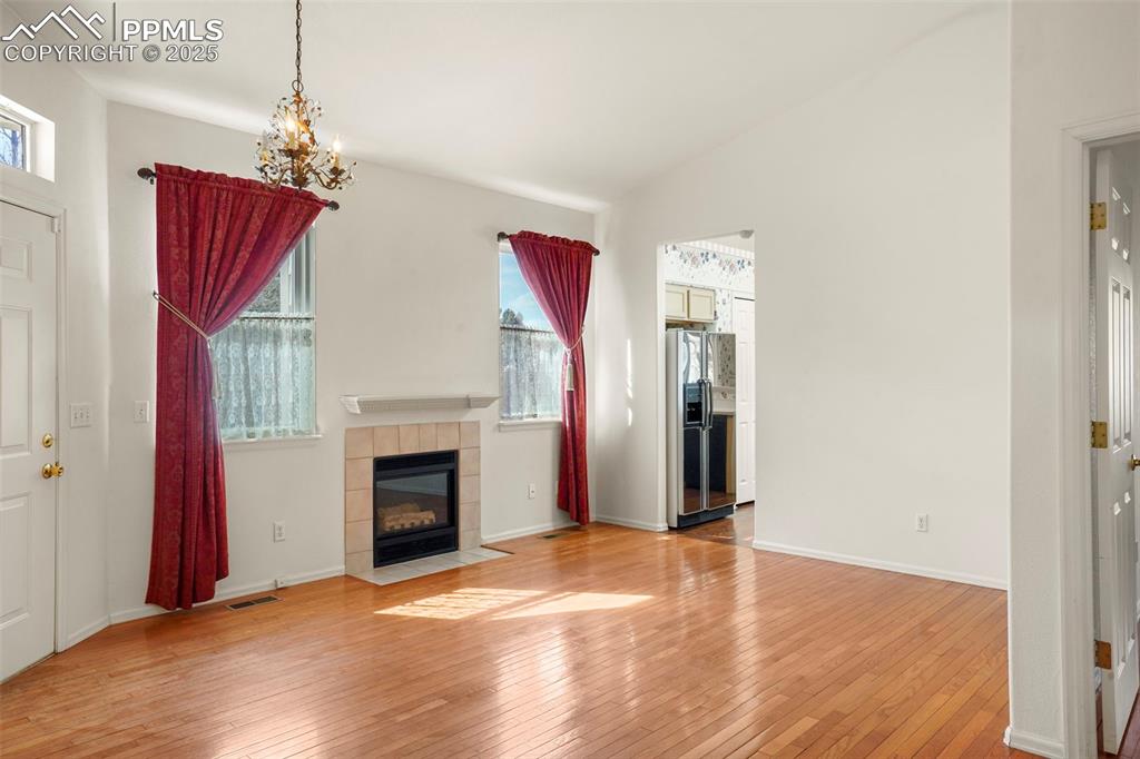 1244 Samuel Point Colorado Springs, CO 80906 - Photo 3 of 22 a view of a livingroom with a fireplace and window