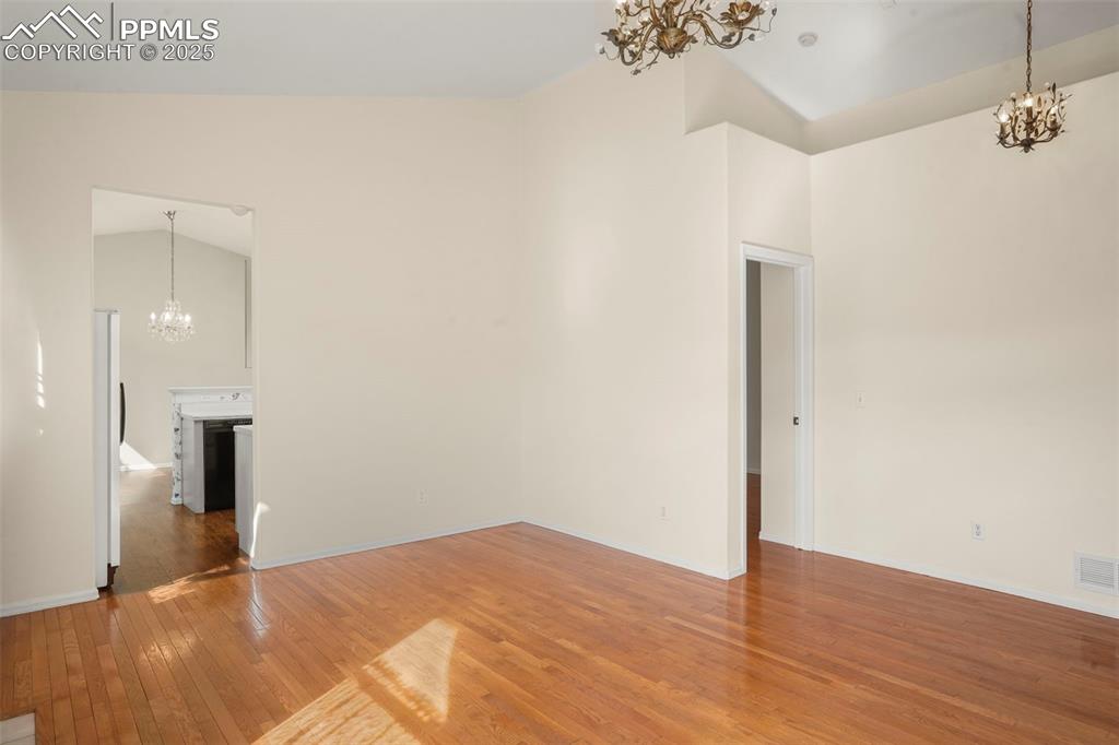 1244 Samuel Point Colorado Springs, CO 80906 - Photo 4 of 22 a view of empty room with wooden floor