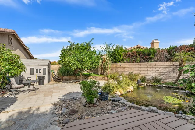 a view of a swimming pool with a patio