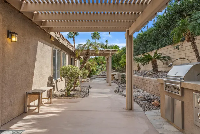a view of a porch with table and chairs