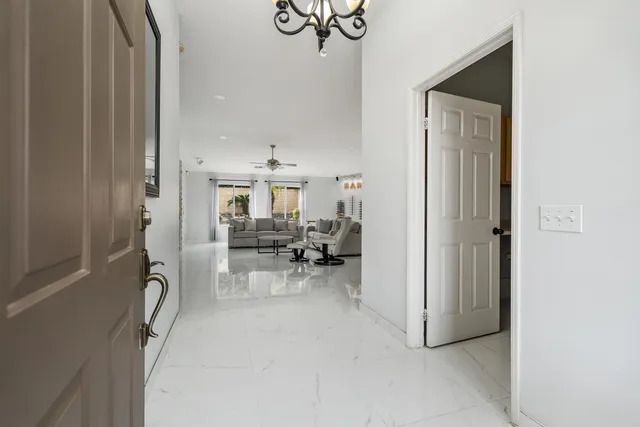 a view of livingroom with furniture and workspace