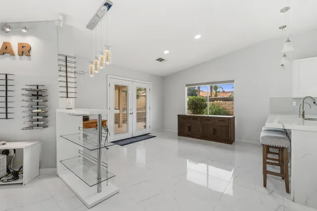 a living room with furniture and white walls