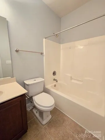 a bathroom with a toilet a sink and a shower