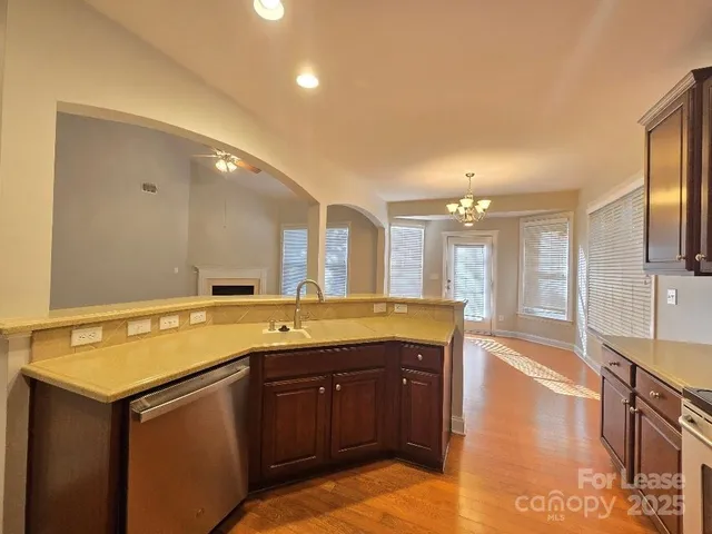 a bathroom with a granite countertop sink and a large mirror