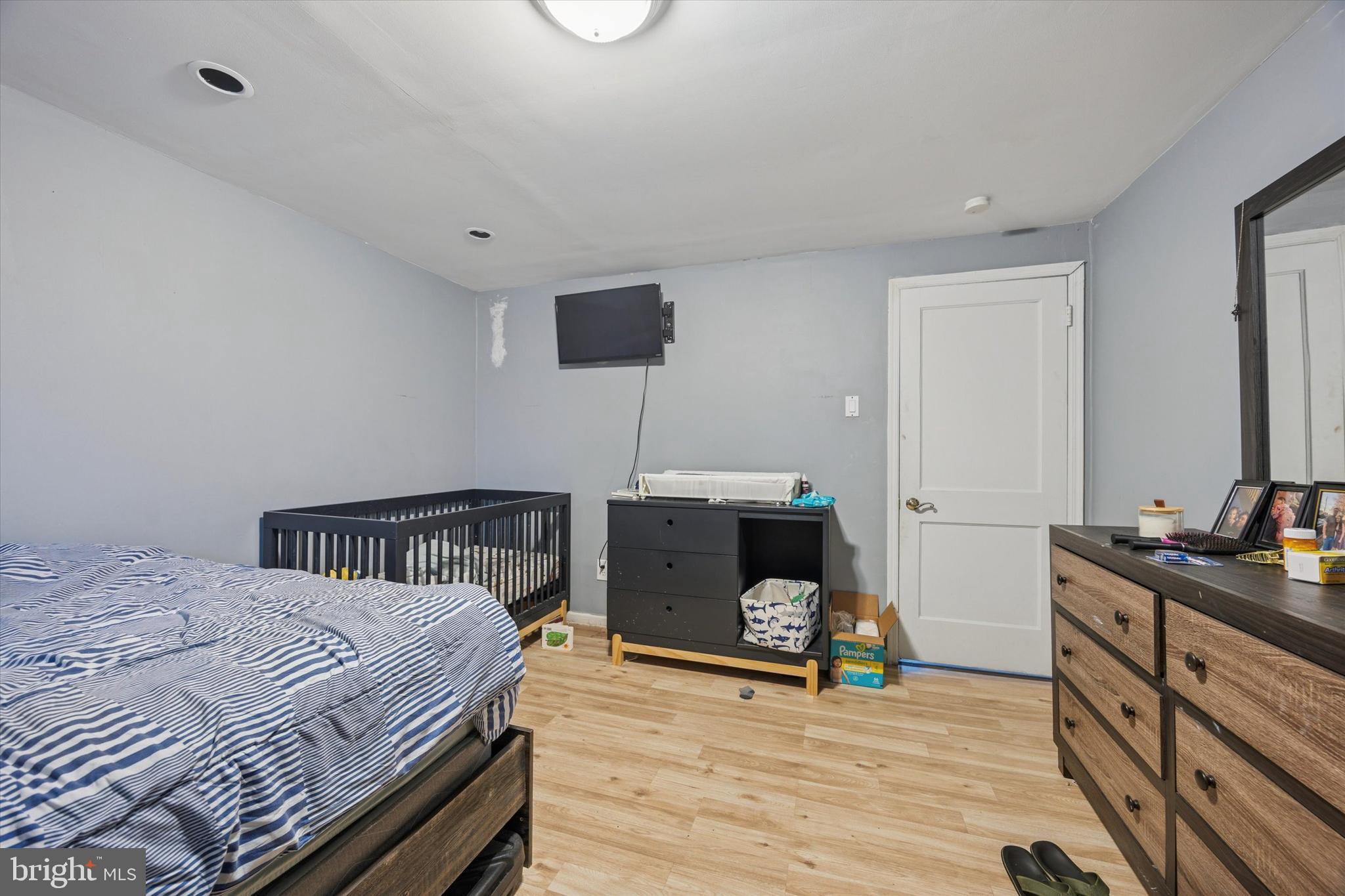 1946 Carter Road Folcroft, PA 19032 - Photo 10 of 26 a bedroom with a bed and a flat screen tv