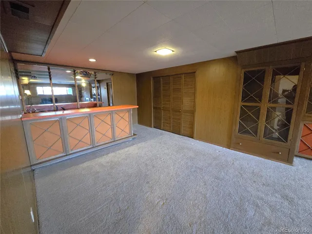 a view of a livingroom with fireplace and window