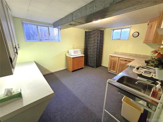 a living room with furniture window and a flat screen tv