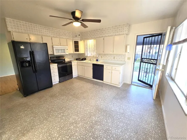 a view of a kitchen with electric appliances