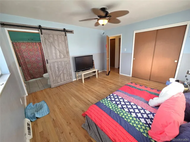 a white toilet sitting next to a bathroom sink and a mirror