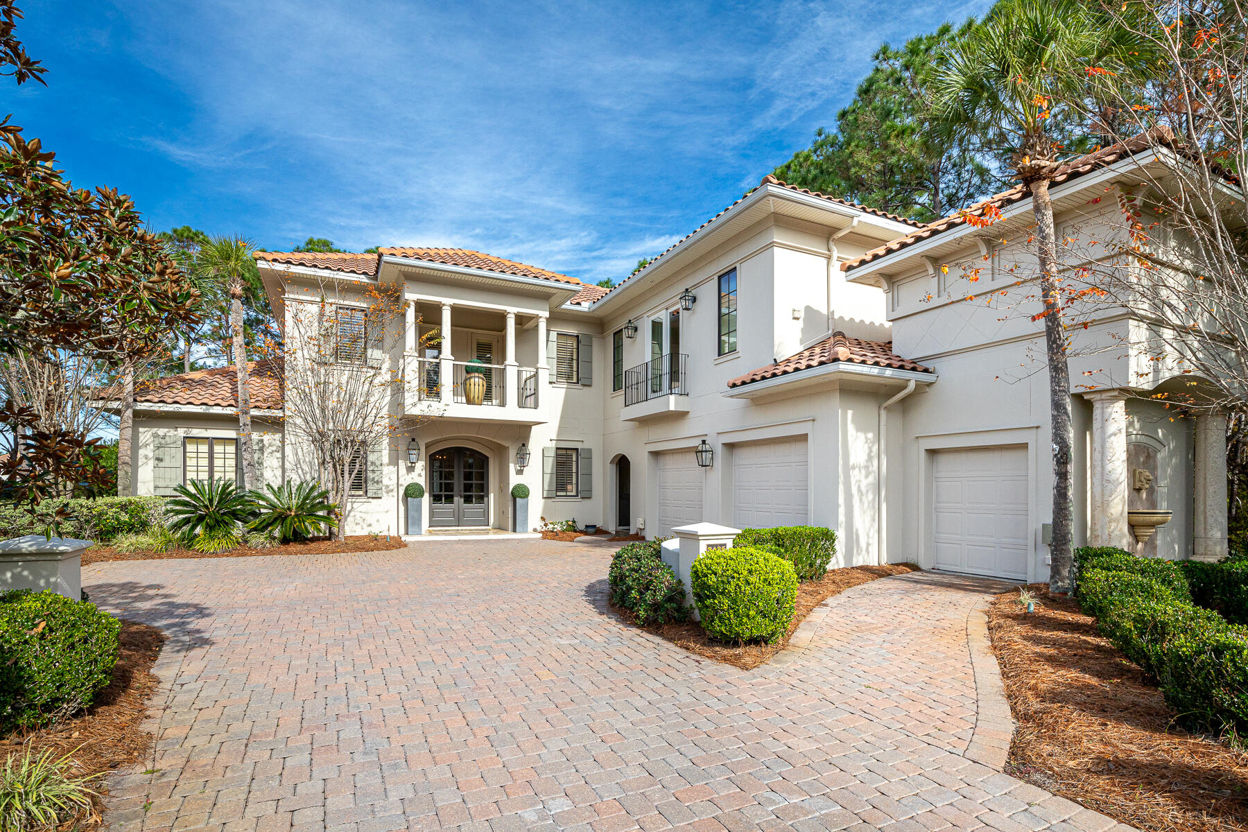 3435 Burnt Pine Lane Miramar Beach, FL 32550 - Photo 1 of 63 a front view of a house with a yard and garage