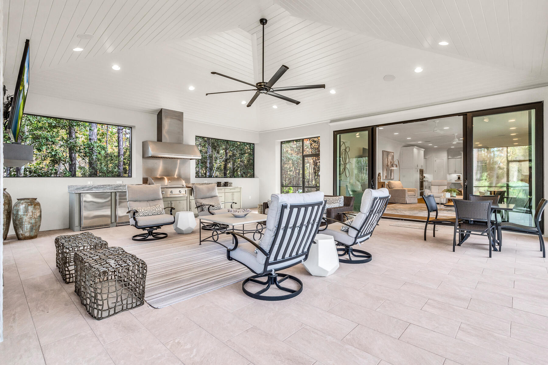 3435 Burnt Pine Lane Miramar Beach, FL 32550 - Photo 18 of 63 a living room with furniture a floor to ceiling window and a flat screen tv
