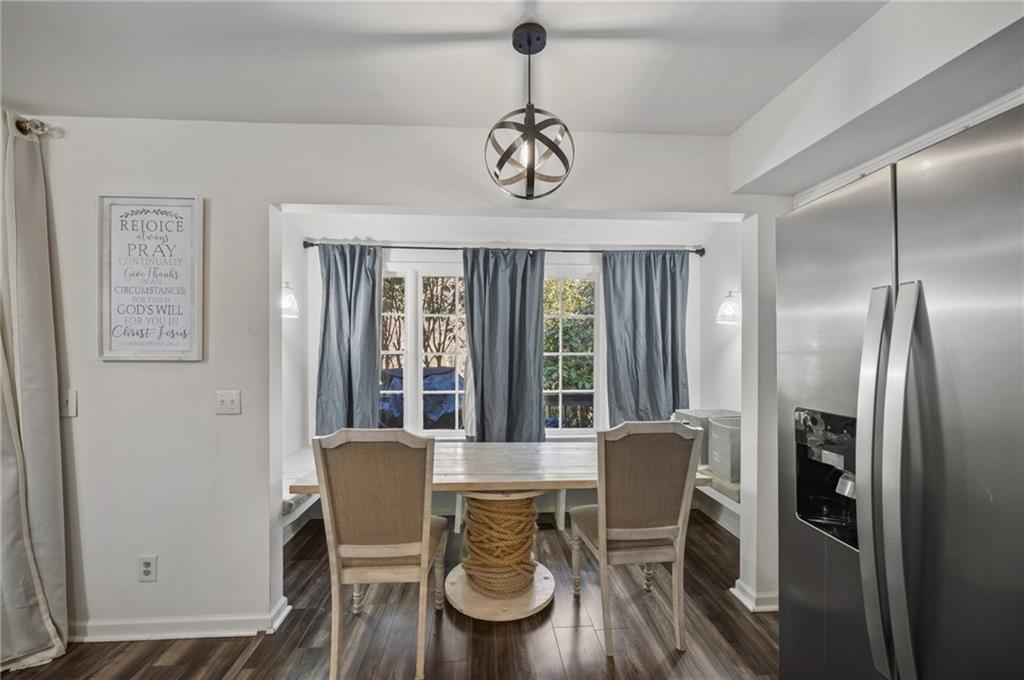 655 Riverside Drive Ellijay, GA 30540 - Photo 17 of 34 a view of a dining room with furniture window and wooden floor