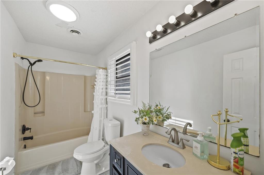655 Riverside Drive Ellijay, GA 30540 - Photo 29 of 34 a bathroom with a sink toilet and shower