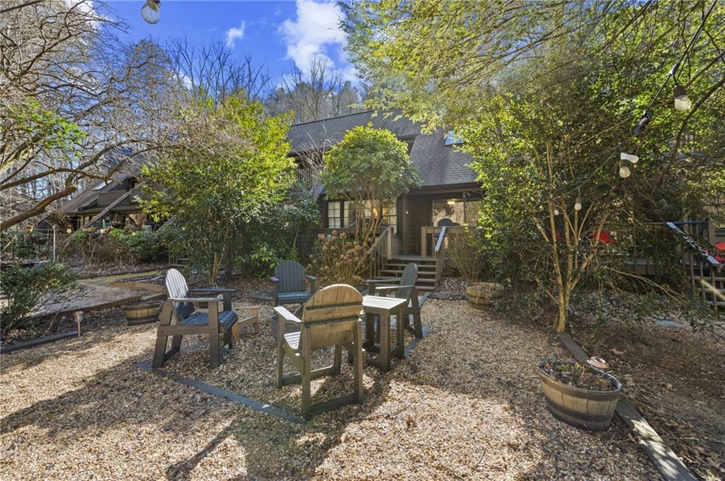 655 Riverside Drive Ellijay, GA 30540 - Photo 34 of 34 a view of a patio with table and chairs and potted plants