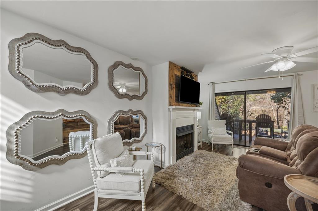 655 Riverside Drive Ellijay, GA 30540 - Photo 6 of 34 a living room with fireplace furniture and a flat screen tv