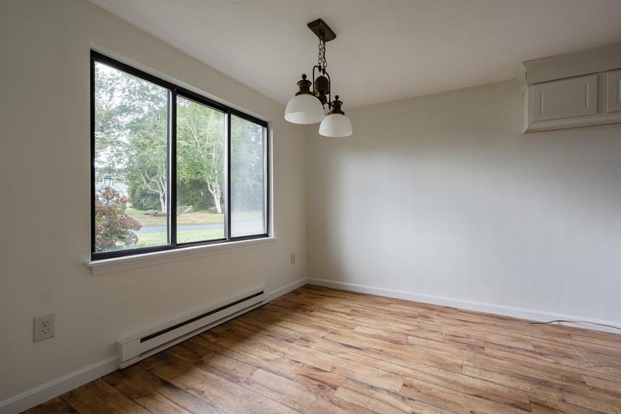 112 Chestnut Circle Brewster, MA 02631 - Photo 12 of 15 wooden floor in an empty room with a window