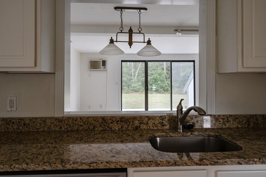 112 Chestnut Circle Brewster, MA 02631 - Photo 13 of 15 a bathroom with a sink a mirror and window