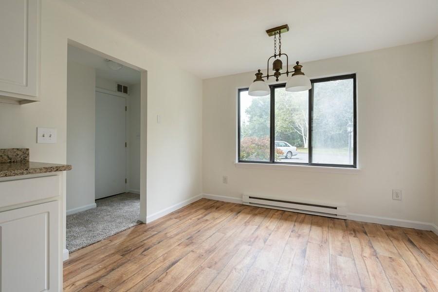 112 Chestnut Circle Brewster, MA 02631 - Photo 3 of 15 a view of empty room with wooden floor and ceiling fan