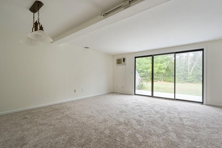112 Chestnut Circle Brewster, MA 02631 - Photo 4 of 15 a view of an empty room with a window