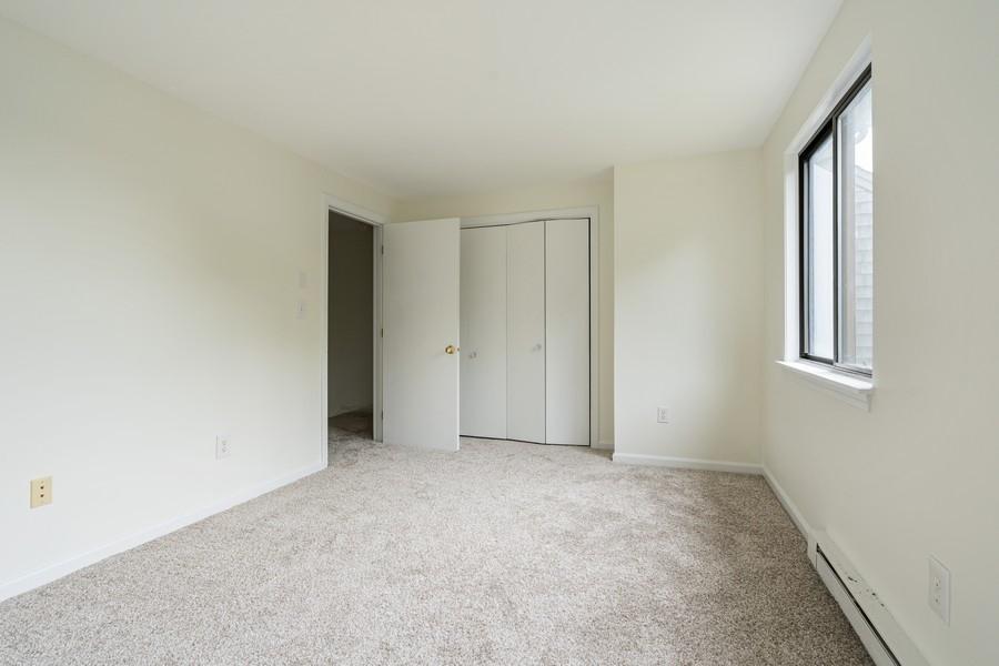 112 Chestnut Circle Brewster, MA 02631 - Photo 9 of 15 an empty room with windows and closet