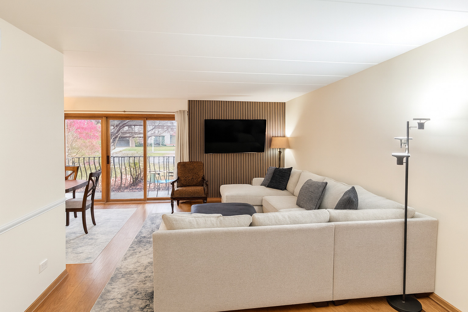 9250 Beloit Avenue, Unit 104 Bridgeview, IL 60455 - Photo 2 of 14 a living room with furniture and a flat screen tv