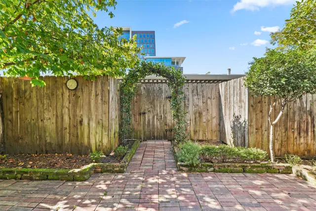 a view of a pathway with a wooden fence