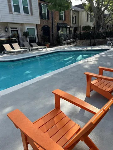 a view of backyard with outdoor seating