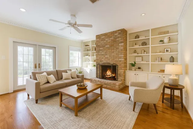 a living room with furniture and a fireplace