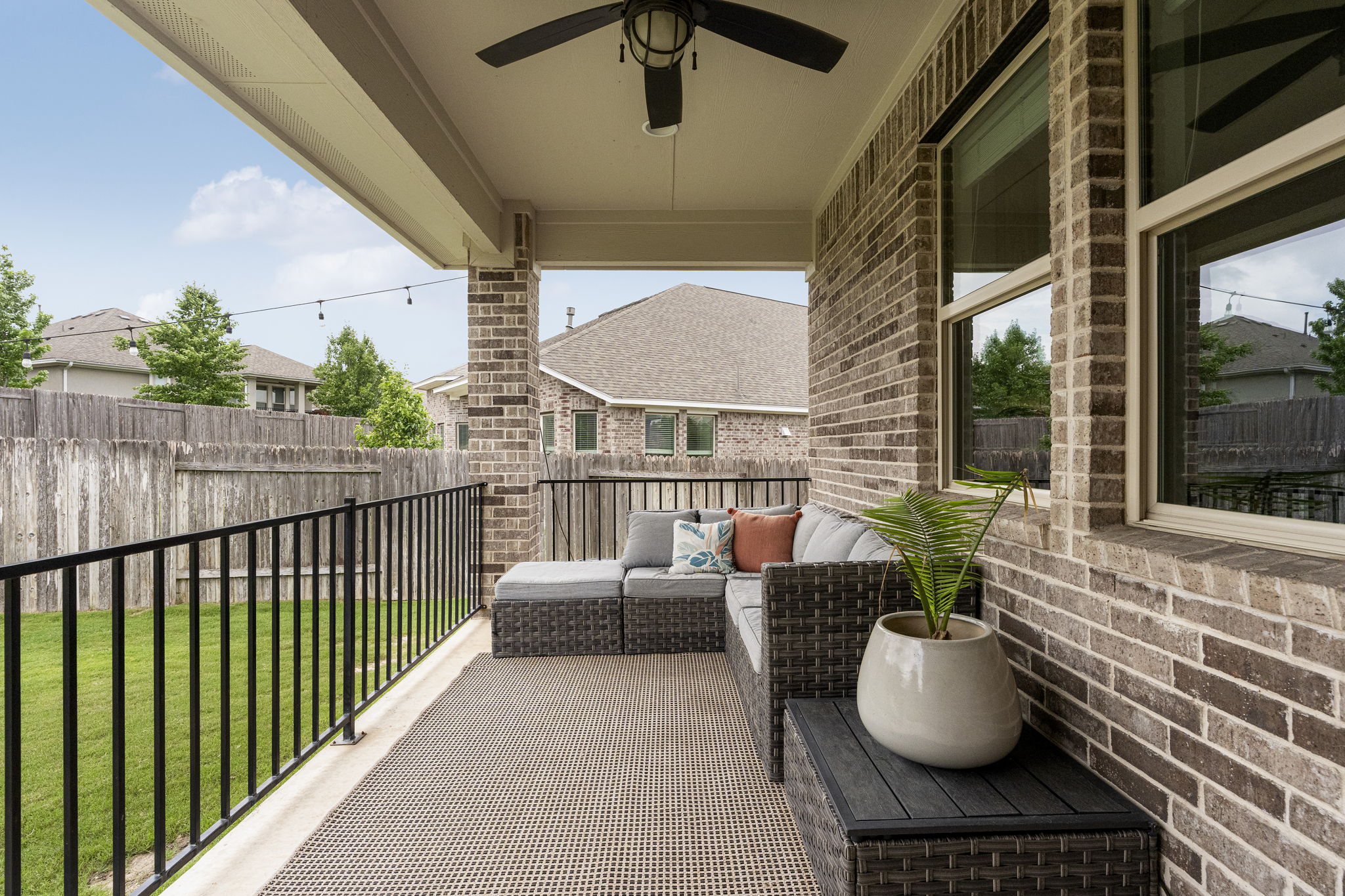 772 Founders Ridge Dripping Springs, TX 78620 - Photo 31 of 40 The covered back porch creates a comfortable extension of the home’s indoor living spaces.