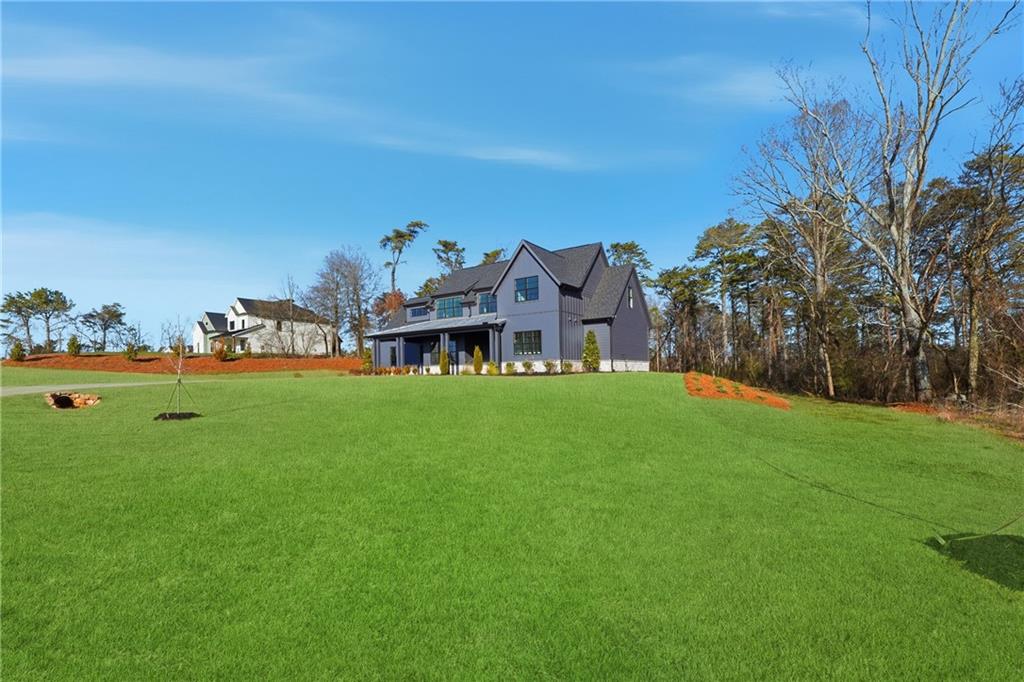 157 Palisade Drive Rydal, GA 30171 - Photo 60 of 68 a table and chairs sitting in the grass
