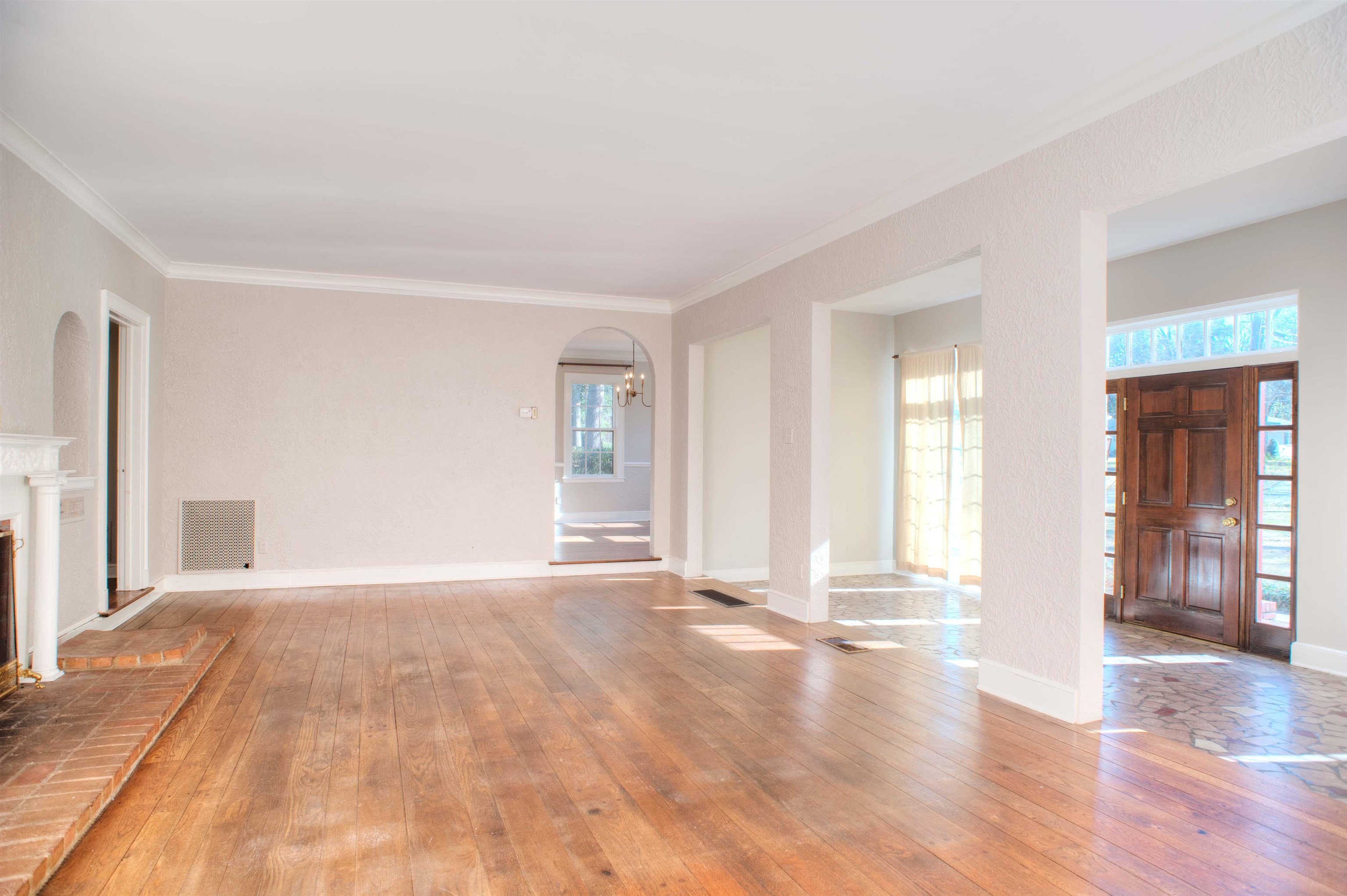 4756 Princeton Road Memphis, TN 38117 - Photo 2 of 22 a view of an empty room with window and wooden floor