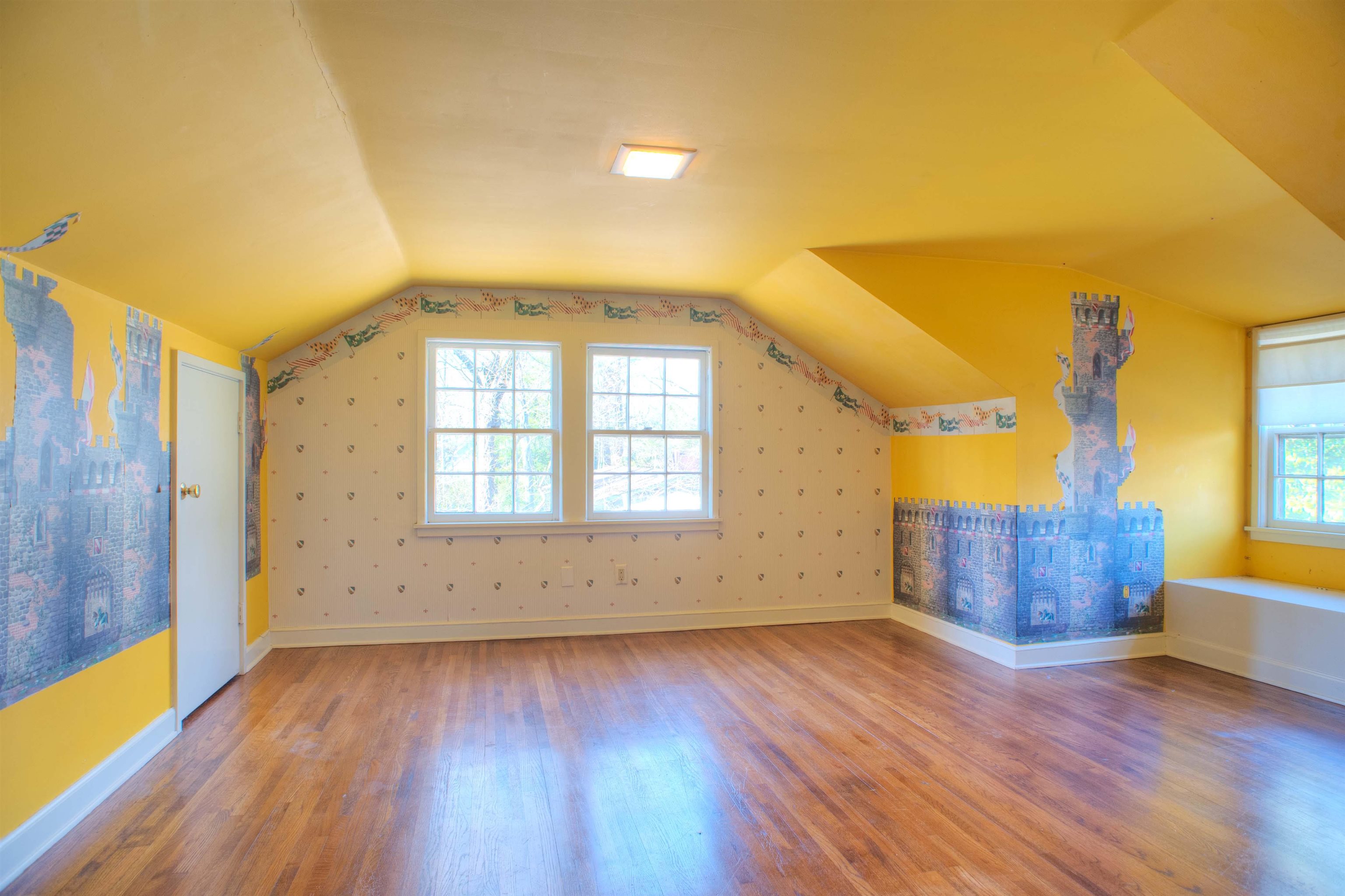 4756 Princeton Road Memphis, TN 38117 - Photo 21 of 22 a view of an empty room with wooden floor and a window