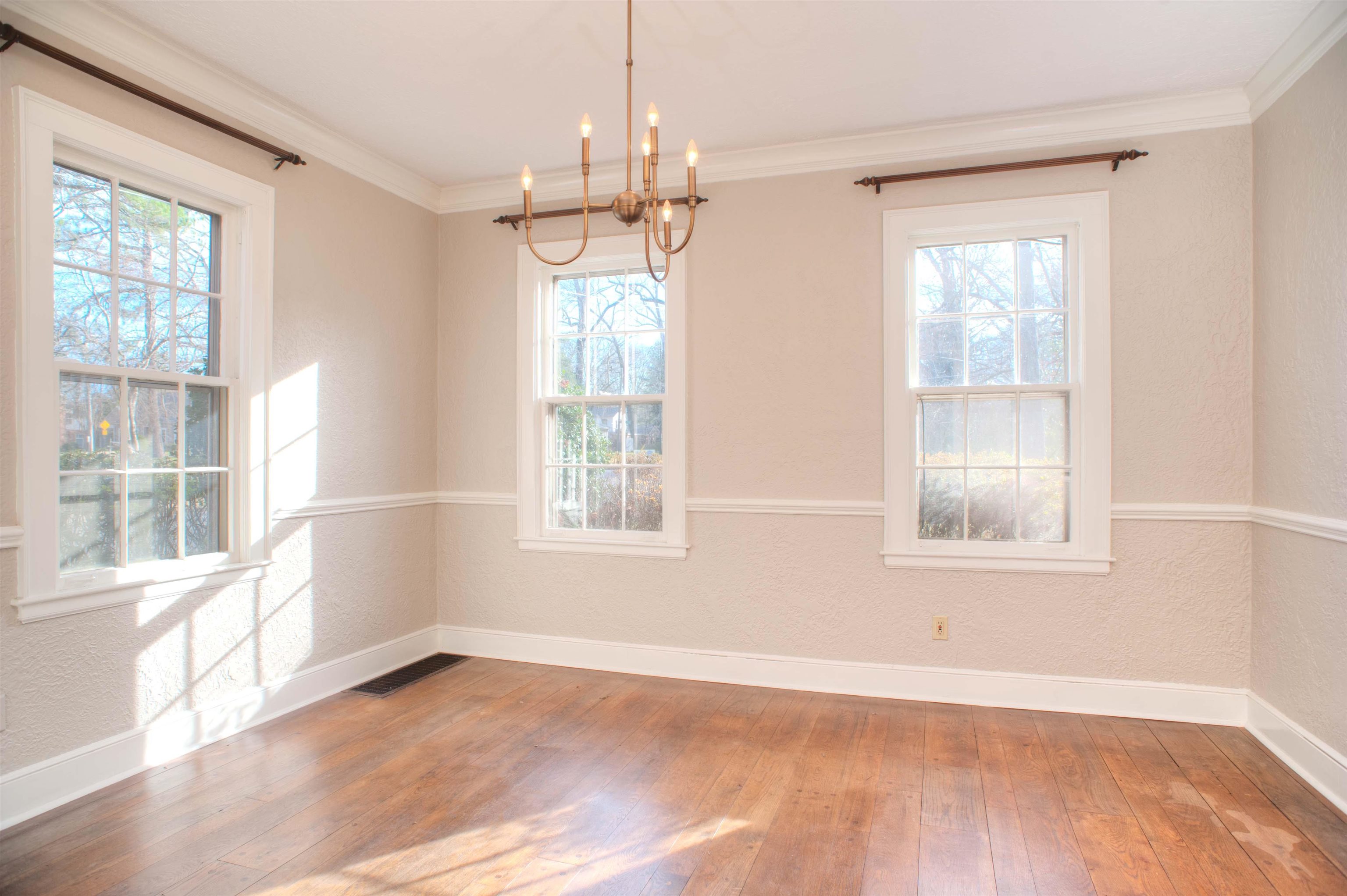 4756 Princeton Road Memphis, TN 38117 - Photo 5 of 22 a view of an empty room with a window and wooden floor