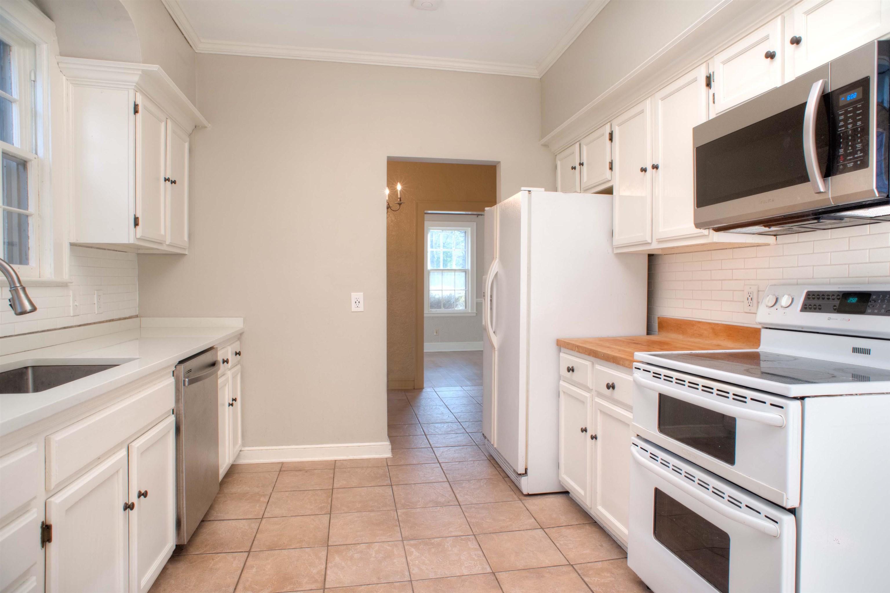 4756 Princeton Road Memphis, TN 38117 - Photo 7 of 22 a kitchen with a stove microwave and refrigerator