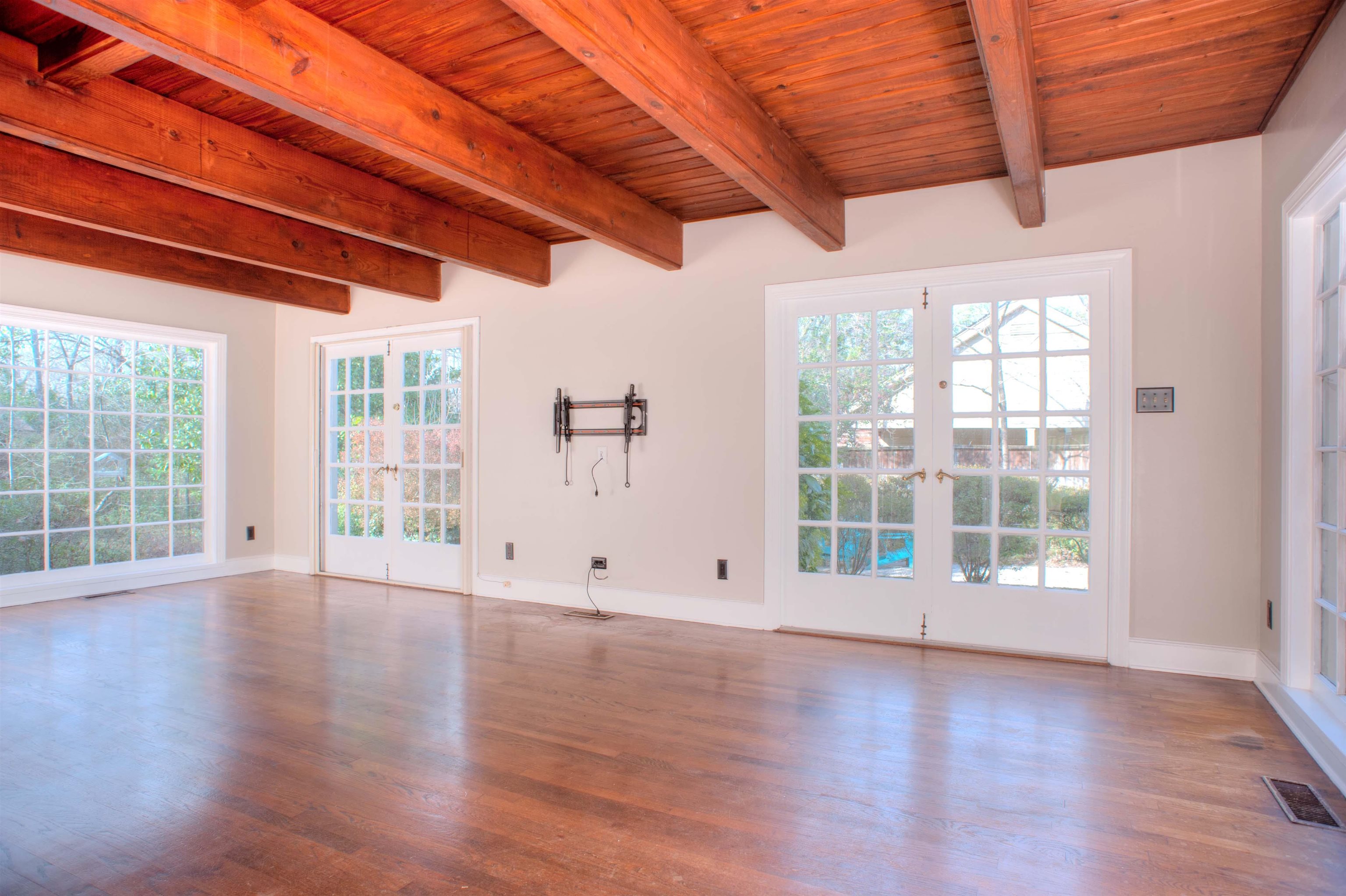 4756 Princeton Road Memphis, TN 38117 - Photo 9 of 22 a view of an empty room with wooden floor and a window
