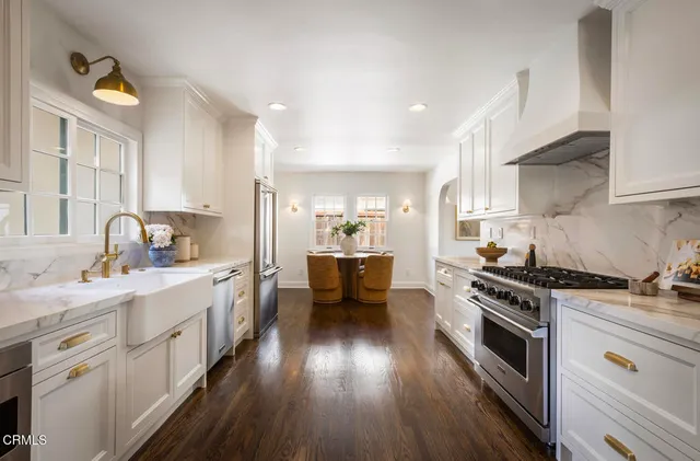 a living room with furniture and a mirror