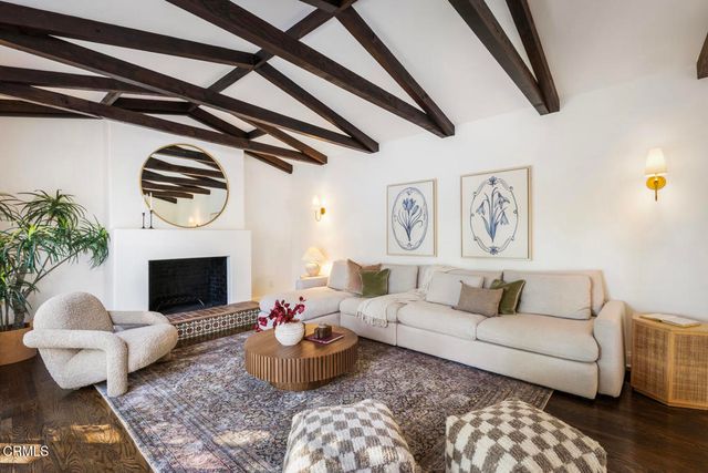 a bedroom with a bed and a fireplace